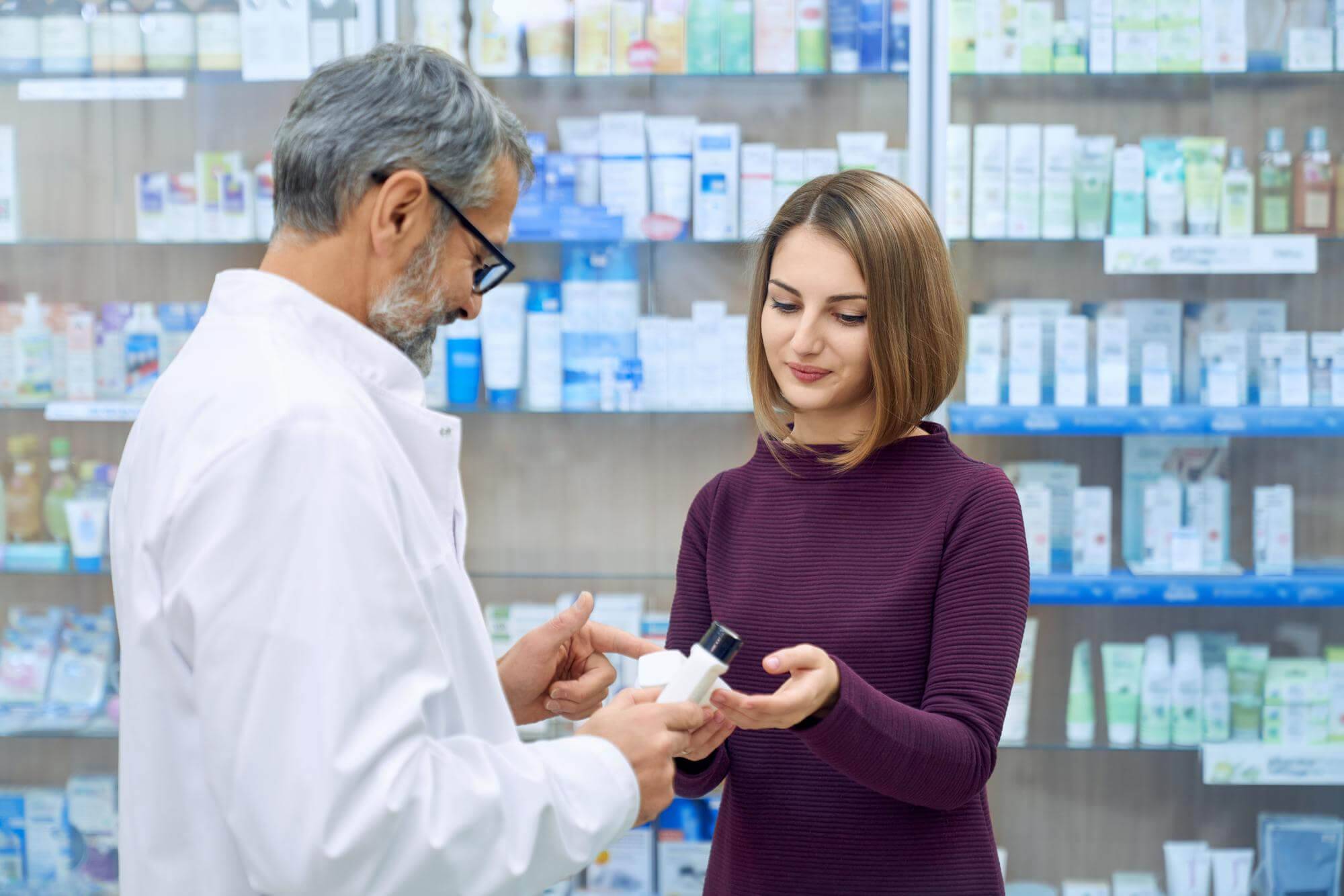 pharmacist-helping-woman-medicine-choice (1)